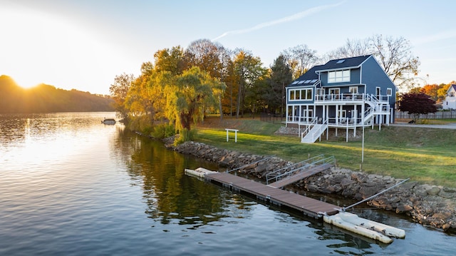 301 John St, Belpre, OH 45714 - view of dock with stairway, a lawn, and a deck with water view