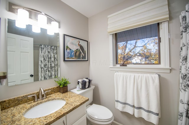 301 John St, Belpre, OH 45714 - bathroom with vanity, a shower with shower curtain, and toilet