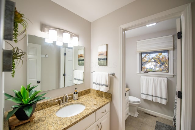 301 John St, Belpre, OH 45714 - bathroom with visible vents, vanity, toilet, baseboards, and tile patterned floors