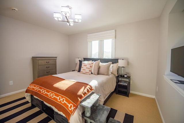 301 John St, Belpre, OH 45714 - bedroom featuring baseboards, a chandelier, and light carpet