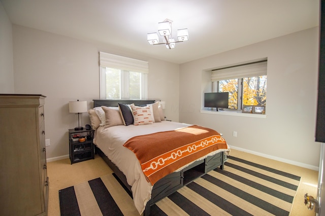 301 John St, Belpre, OH 45714 - bedroom with baseboards, multiple windows, and light colored carpet