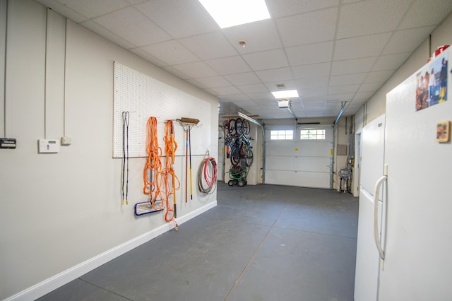 301 John St, Belpre, OH 45714 - garage with baseboards and freestanding refrigerator
