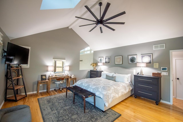 301 John St, Belpre, OH 45714 - bedroom featuring visible vents, a skylight, high vaulted ceiling, beamed ceiling, and light wood-style flooring