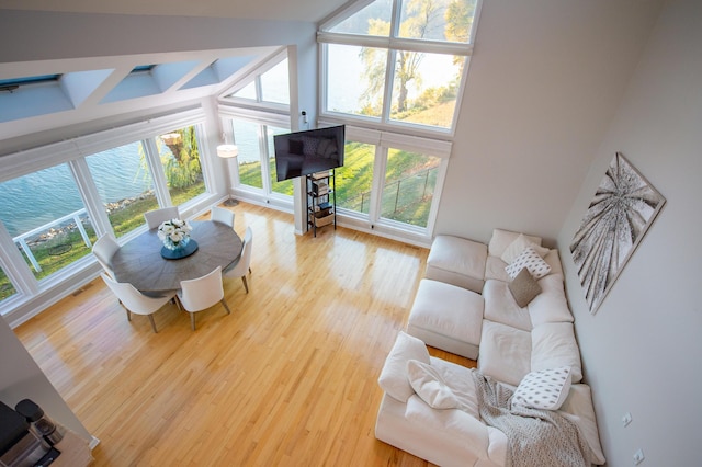 301 John St, Belpre, OH 45714 - living area featuring a high ceiling, beamed ceiling, and wood finished floors