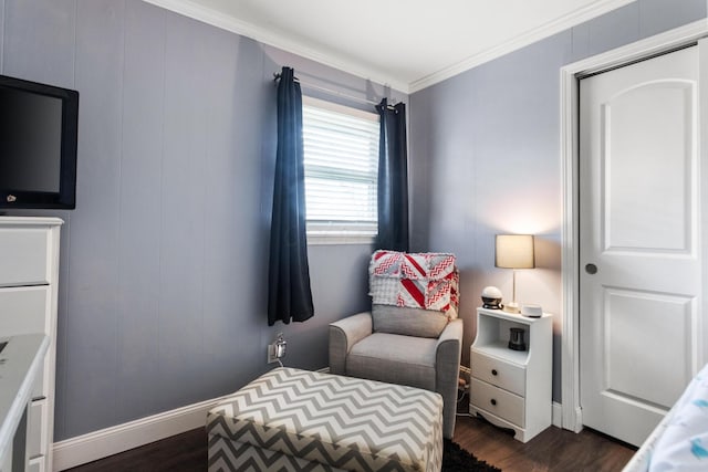 bedroom featuring crown molding, baseboards, and dark wood finished floors