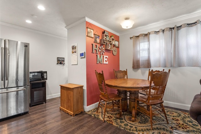 dining space with dark wood-type flooring, ornamental molding, baseboards, and recessed lighting