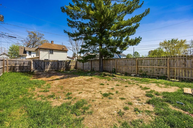 view of yard with a fenced backyard