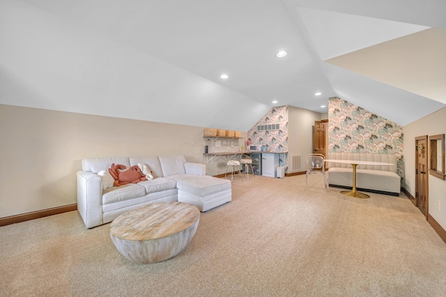 living room featuring visible vents, baseboards, lofted ceiling, and carpet floors