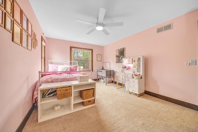 carpeted bedroom featuring visible vents, ceiling fan, and baseboards