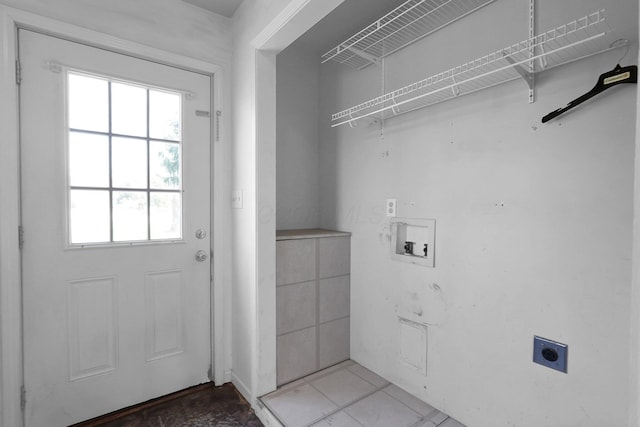 clothes washing area with hookup for an electric dryer, laundry area, hookup for a washing machine, and a wealth of natural light
