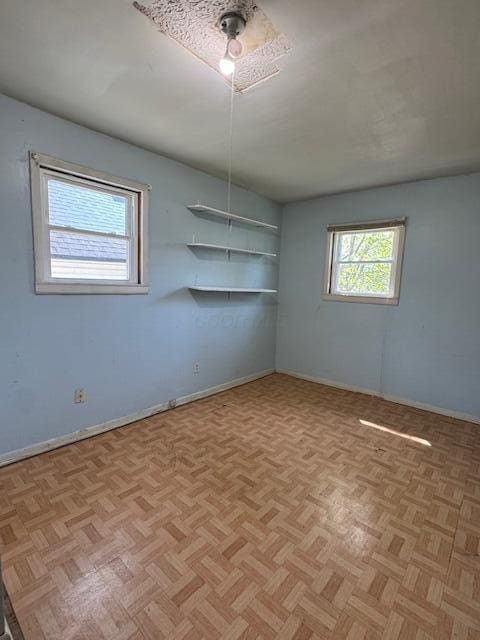 empty room with baseboards