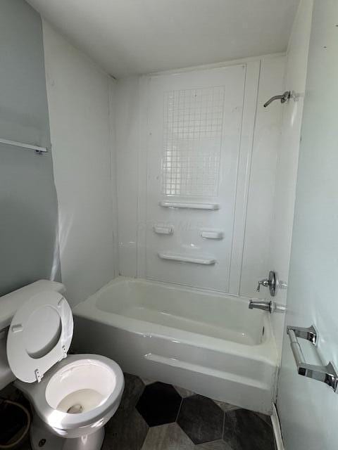 full bathroom with tile patterned flooring, toilet, and shower / bath combination