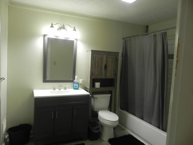 bathroom featuring toilet, shower / bath combo, and vanity