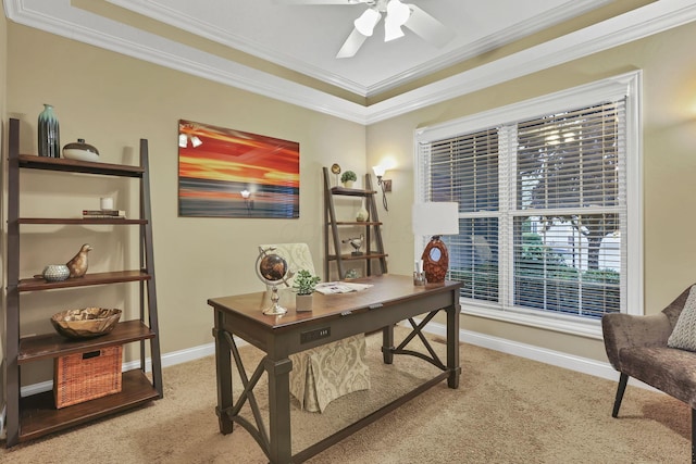 home office with a ceiling fan, baseboards, light carpet, and ornamental molding