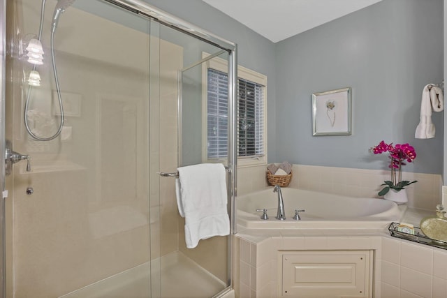 bathroom with a garden tub and a stall shower