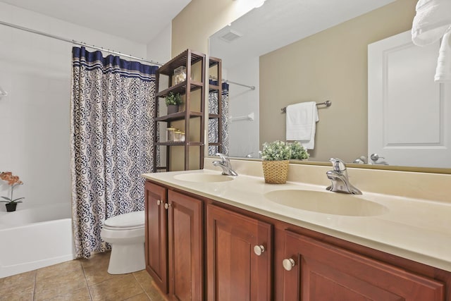 full bath with visible vents, a sink, tile patterned flooring, and toilet