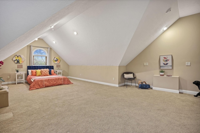 unfurnished bedroom with carpet floors, baseboards, and lofted ceiling