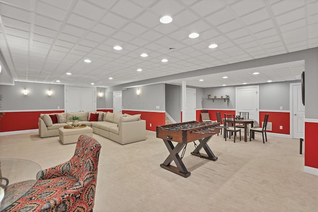 rec room with baseboards, recessed lighting, wainscoting, and light carpet