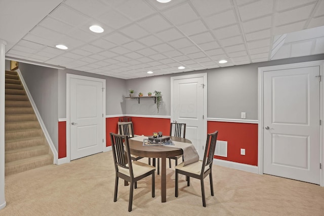 dining space featuring recessed lighting, baseboards, light carpet, and stairway