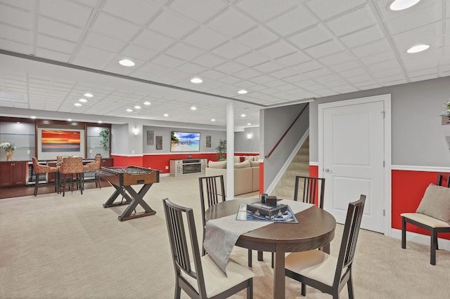 dining space featuring baseboards, recessed lighting, carpet, and stairway