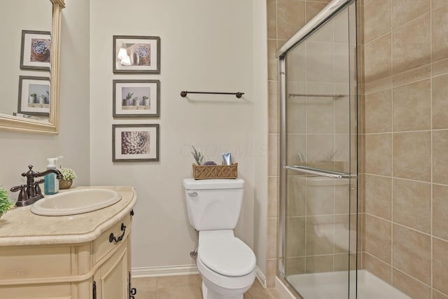 full bathroom with tile patterned flooring, vanity, toilet, baseboards, and a shower stall