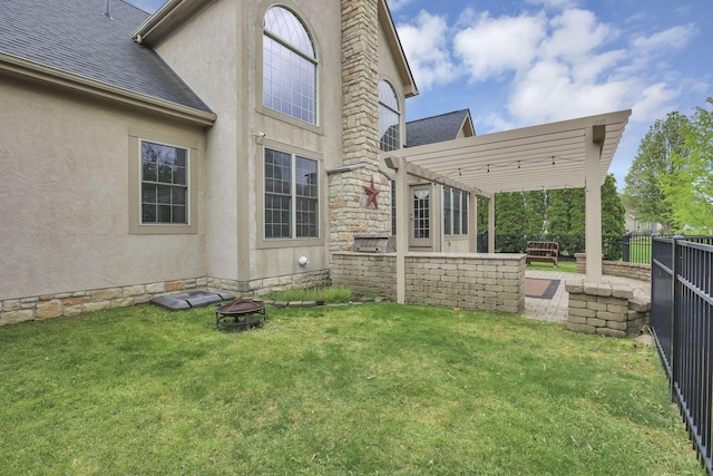 rear view of house with a fire pit, a fenced backyard, a pergola, a shingled roof, and stucco siding