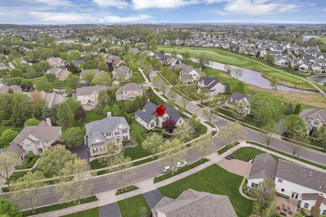 aerial view with a water view, view of golf course, and a residential view