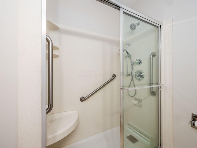 full bath featuring a shower stall