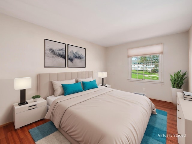 bedroom with wood finished floors