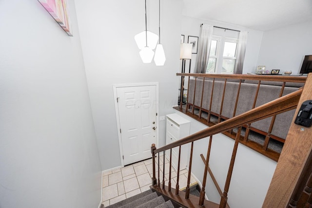 stairway featuring tile patterned floors