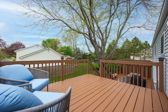 wooden deck featuring an outbuilding