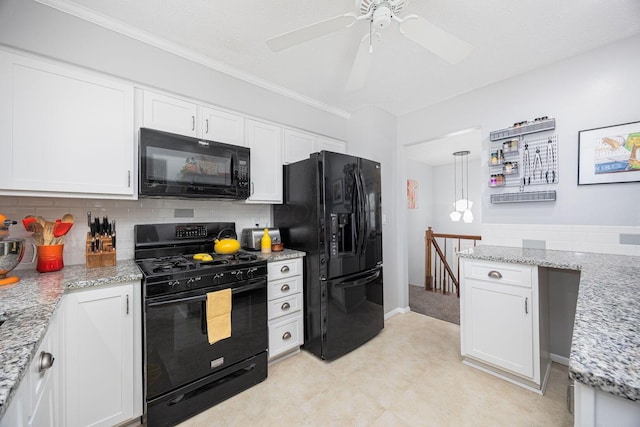kitchen featuring backsplash, light stone counters, black appliances, light floors, and white cabinetry