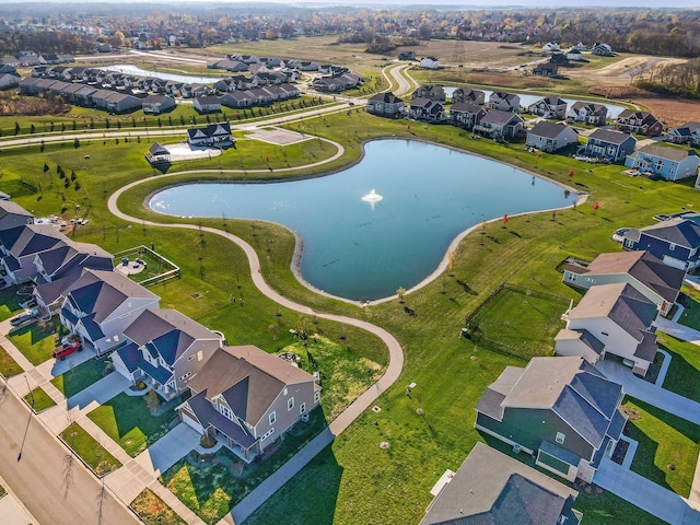 bird's eye view with a residential view and a water view