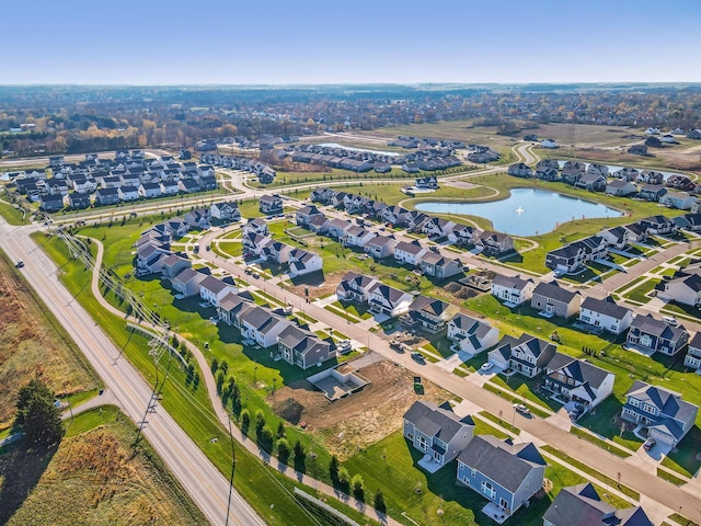 bird's eye view featuring a residential view and a water view