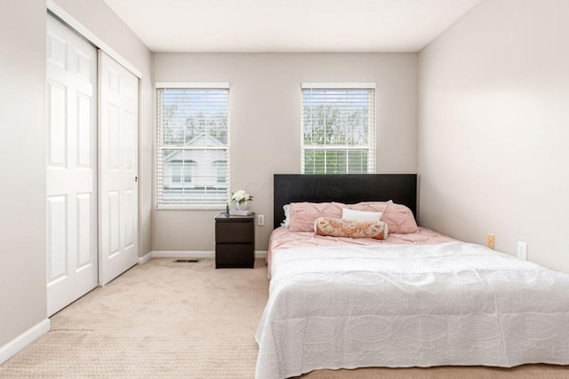 bedroom featuring carpet floors and baseboards