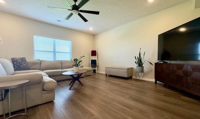 living room with a ceiling fan, baseboards, recessed lighting, wood finished floors, and visible vents