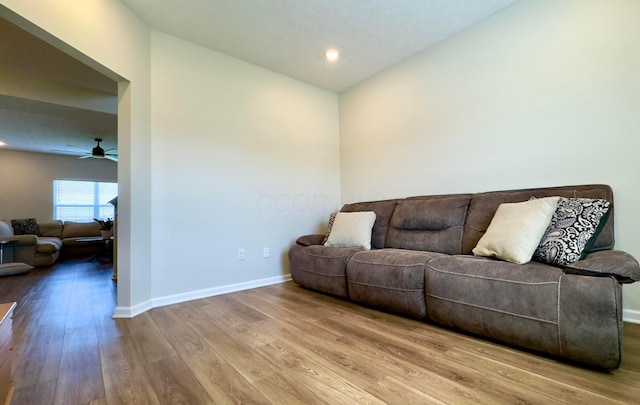 living room featuring baseboards, recessed lighting, ceiling fan, and wood finished floors