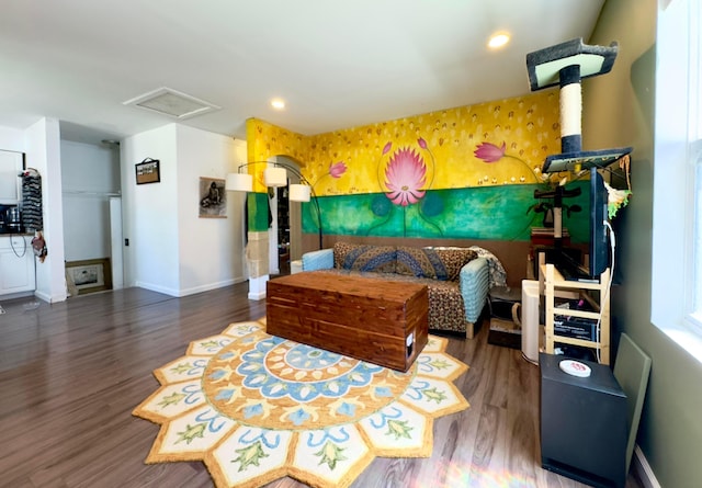 bedroom featuring baseboards, attic access, wood finished floors, and recessed lighting