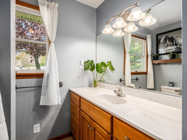 1305 Cooperriders Rd NW, Somerset, OH 43783 - bathroom featuring vanity and a notable chandelier