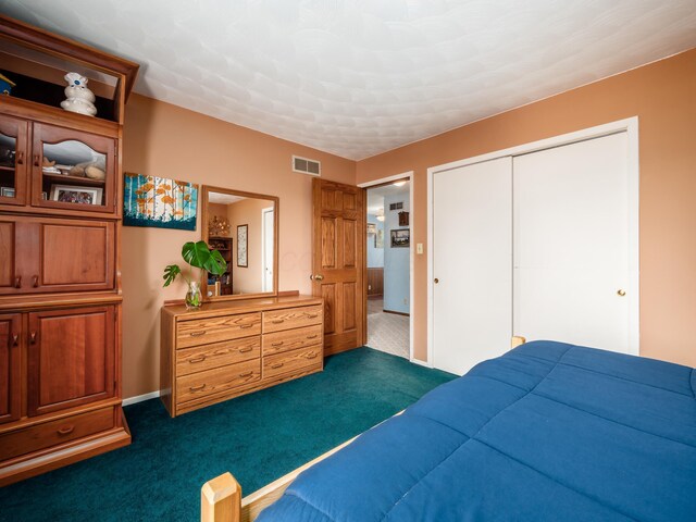 1305 Cooperriders Rd NW, Somerset, OH 43783 - bedroom with baseboards, a closet, dark carpet, and visible vents
