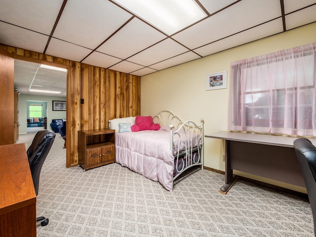1305 Cooperriders Rd NW, Somerset, OH 43783 - bedroom with baseboards, light carpet, a drop ceiling, and wood walls