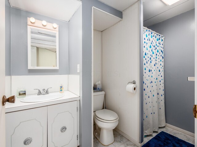 1305 Cooperriders Rd NW, Somerset, OH 43783 - full bath featuring vanity, baseboards, toilet, and a shower with shower curtain