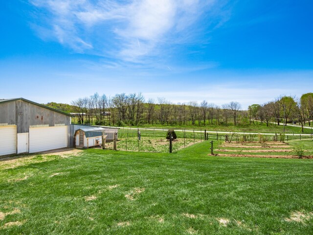 1305 Cooperriders Rd NW, Somerset, OH 43783 - view of yard with an outdoor structure, a garage, fence, and a pole building