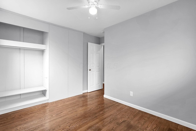 542 E Franklin St, Circleville, OH 43113 - unfurnished bedroom with baseboards, ceiling fan, a closet, and wood finished floors
