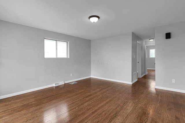 542 E Franklin St, Circleville, OH 43113 - empty room with visible vents, baseboards, and wood finished floors