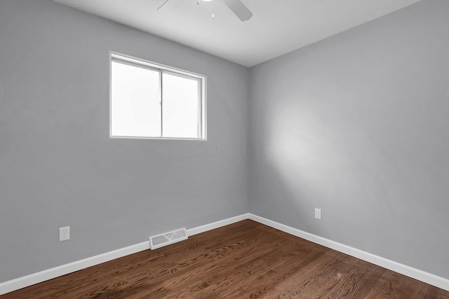 542 E Franklin St, Circleville, OH 43113 - unfurnished room with baseboards, visible vents, dark wood-style floors, and ceiling fan
