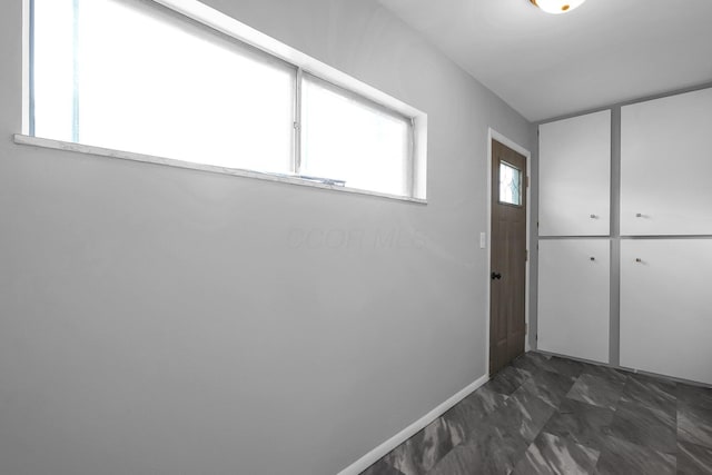 542 E Franklin St, Circleville, OH 43113 - doorway to outside featuring baseboards and marble finish floor