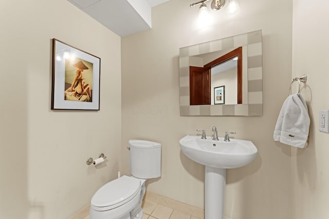 1 Miranova Pl Unit 1505, Columbus, OH 43215 - bathroom featuring tile patterned floors, toilet, baseboards, and a sink