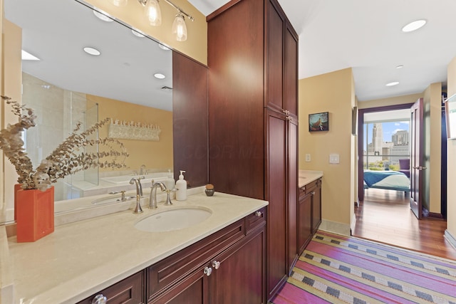 1 Miranova Pl Unit 1505, Columbus, OH 43215 - full bathroom featuring vanity, a shower stall, connected bathroom, recessed lighting, and a bath