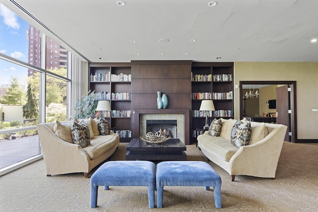 1 Miranova Pl Unit 1505, Columbus, OH 43215 - living room with a premium fireplace, built in features, recessed lighting, and expansive windows